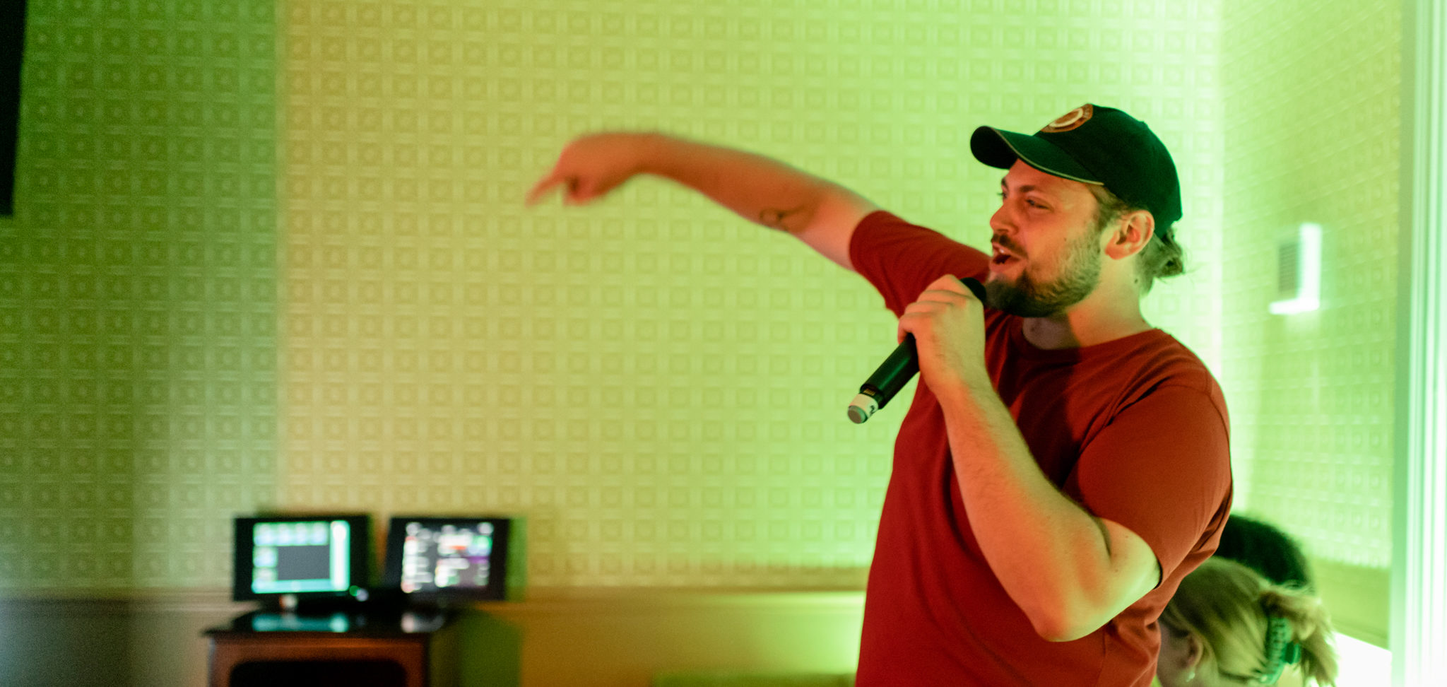 Singing in the 90s themed karaoke pod at The Old Grindstone pub