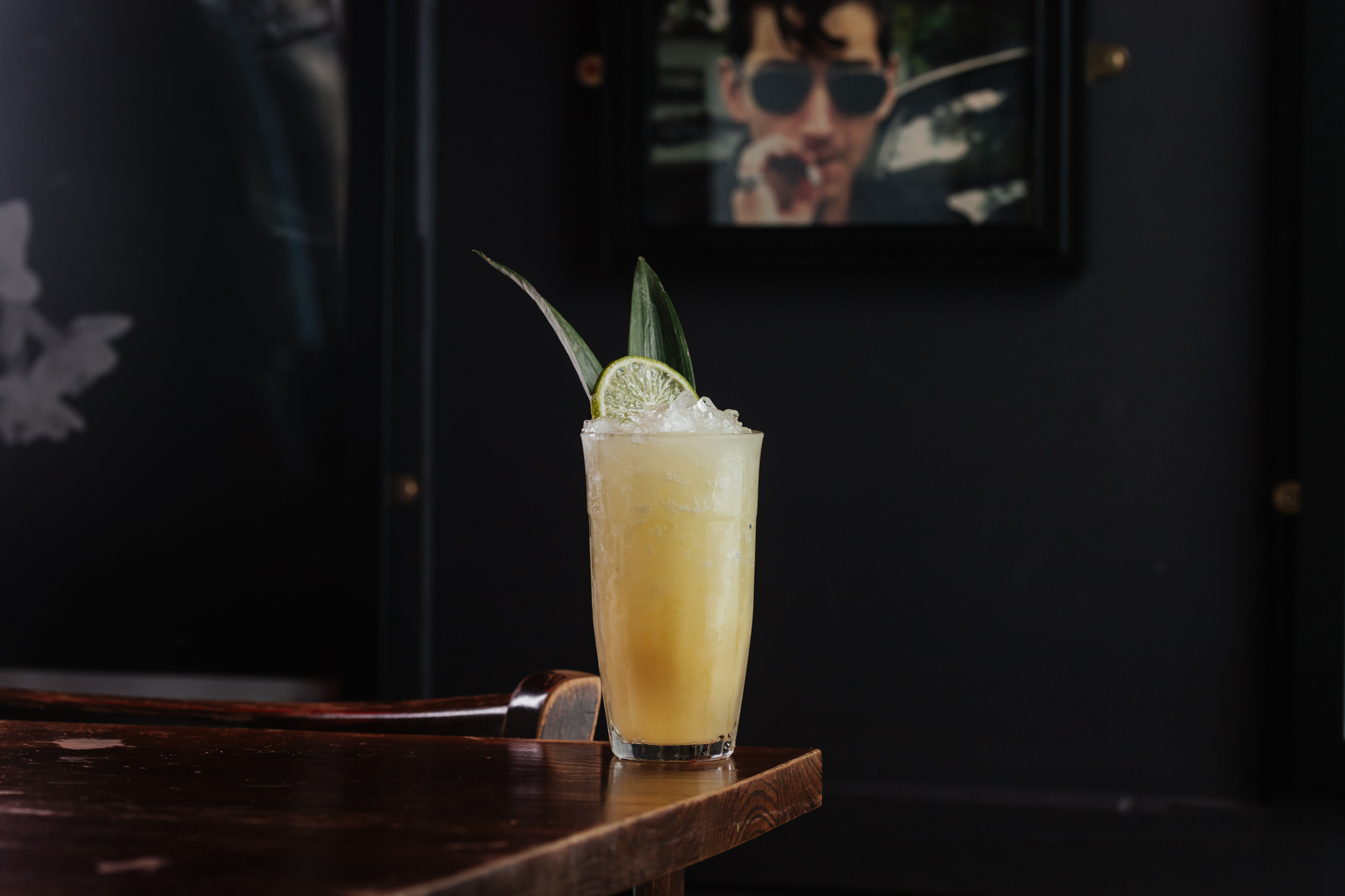 Zombie cocktail at The Old Grindstone with lemon and bamboo leaf garnish